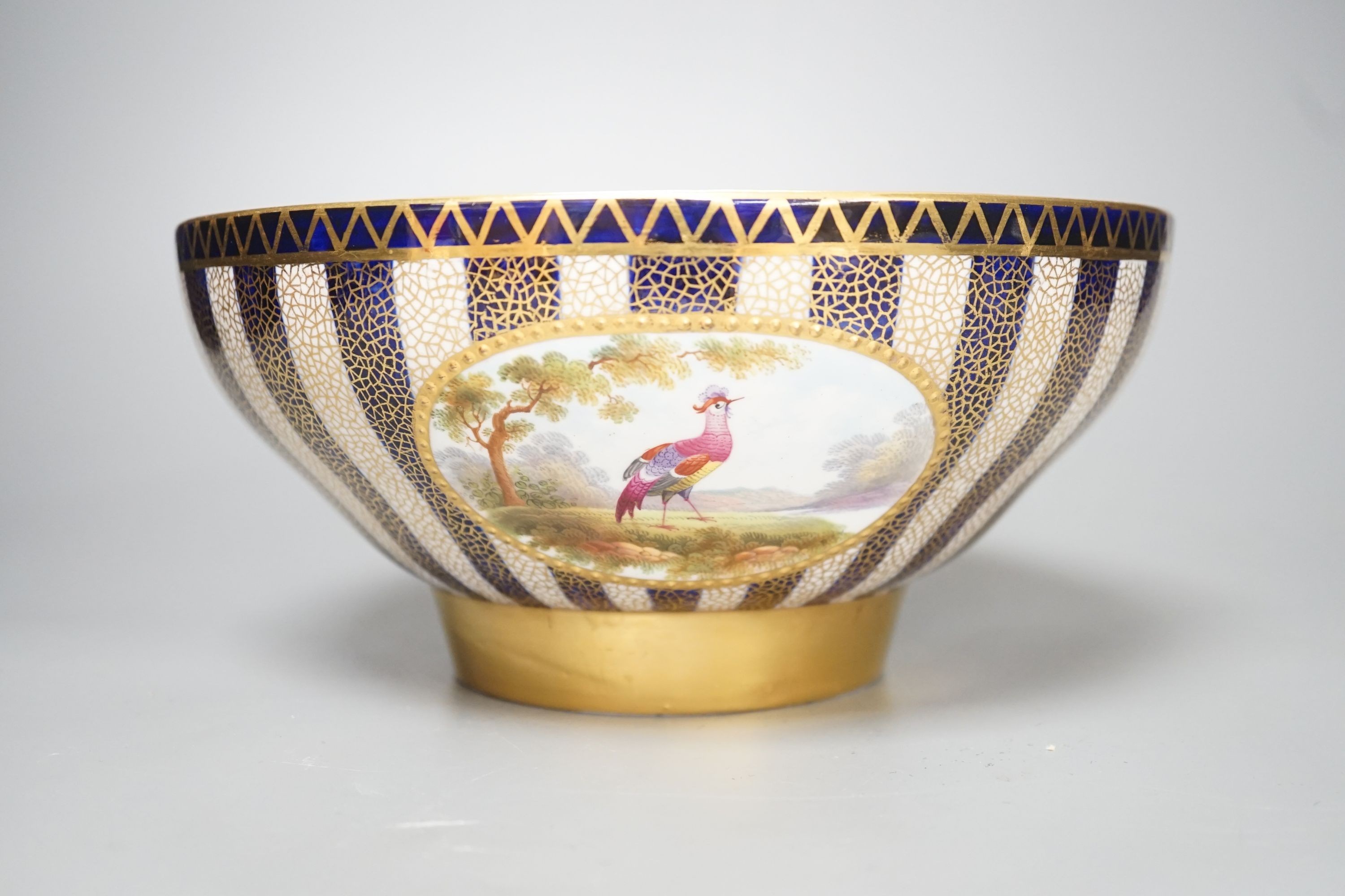 An Aynsley fine bowl with three interior landscape panels and three exterior panels painted with birds between alternating blue and white gilt stripes four panels signed R.J.K. for Richard J. Keeling, c.1910, height 10.5